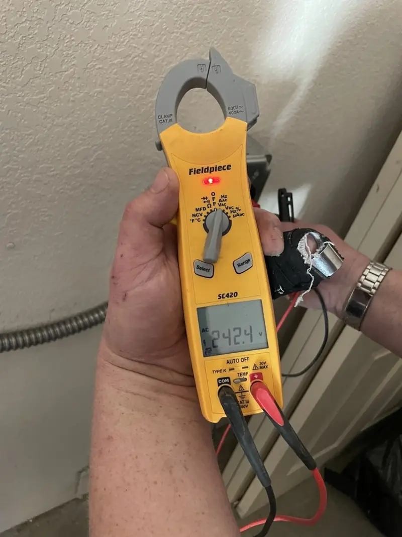 Voltage testing with clamp meter during Ceiling Fan Installation in Prospect Park